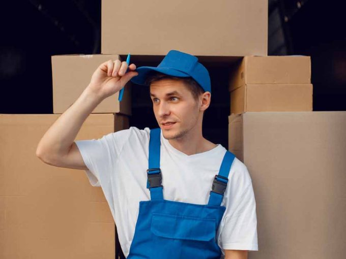 deliveryman-in-uniform-parcels-in-the-car-cargo-2023-11-27-04-56-33-utc